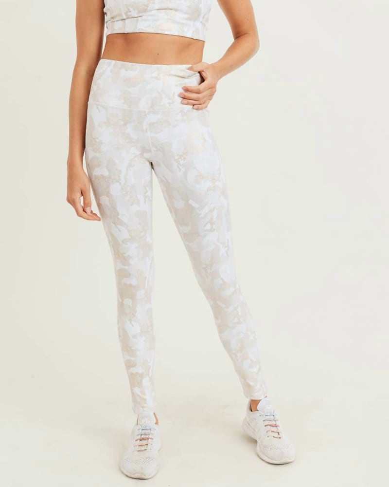 Front of a model wearing a size L Microdot Foil High-Waisted Legging In Camo/Gold in Camo/Gold by mono b. | dia_product_style_image_id:358009